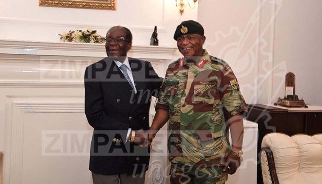 President Robert Mugabe poses with General Constantino Chiwenga at State House in Harare, Zimbabwe, November 16, 2017. ZIMPAPERS/Joseph Nyadzayo/Handout via REUTERS ATTENTION EDITORS - THIS IMAGE HAS BEEN SUPPLIED BY A THIRD PARTY. NO RESALES. NO ARCHIVES. ZIMBABWE OUT TPX IMAGES OF THE DAY