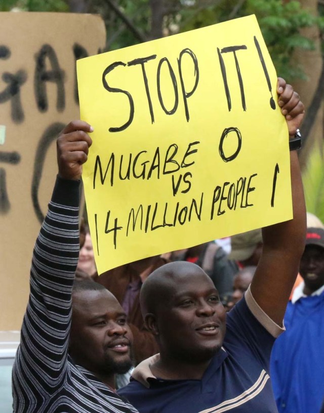 Protesters calling for Zimbabwean President Robert Mugabe to step down take to the streets in Harare, Zimbabwe, November 18, 2017. REUTERS/Philimon Bulawayo
