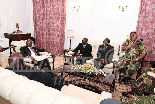 President Robert Mugabe meets with senior members of the Zimbabwe Defence Forces and police at State House in Harare, Zimbabwe November 19, 2017. ZIMPAPERS/Joseph Nyadzayo/Handout via REUTERS ATTENTION EDITORS - THIS IMAGE HAS BEEN SUPPLIED BY A THIRD PARTY. NO RESALES. NO ARCHIVES. ZIMBABWE OUT