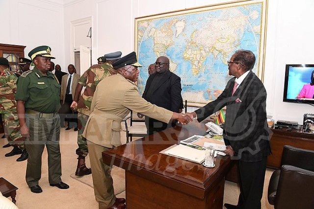 President Robert Mugabe meets with senior members of the Zimbabwe Defence Forces and police at State House in Harare, Zimbabwe November 19, 2017. ZIMPAPERS/Joseph Nyadzayo/Handout via REUTERS ATTENTION EDITORS - THIS IMAGE HAS BEEN SUPPLIED BY A THIRD PARTY. NO RESALES. NO ARCHIVES. ZIMBABWE OUT