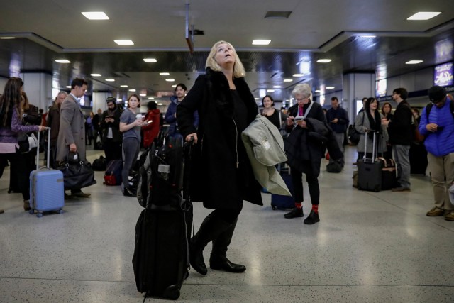 Passengers wait for Amtrak trains to be called, ahead of the Thanksgiving Day holiday, at Pennsylvania Station in New York City, U.S., November 22, 2017. REUTERS/Brendan McDermid