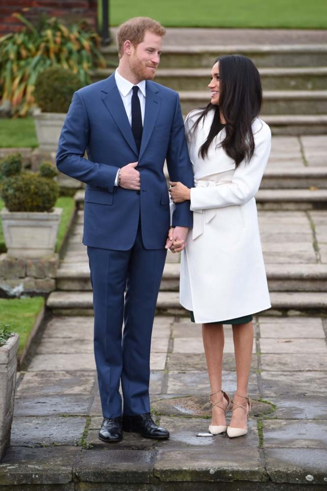 Britain's Prince Harry poses with Meghan Markle in the Sunken Garden of Kensington Palace, London, Britain, November 27, 2017. REUTERS/Eddie Mulholland/Pool