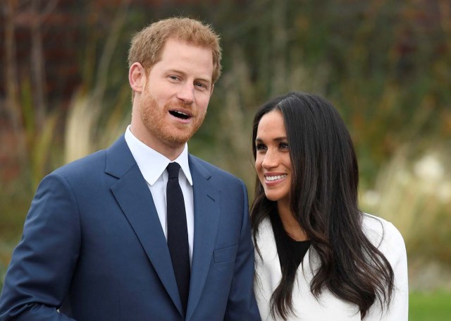 Britain's Prince Harry poses with Meghan Markle in the Sunken Garden of Kensington Palace, London, Britain, November 27, 2017. REUTERS/Toby Melville