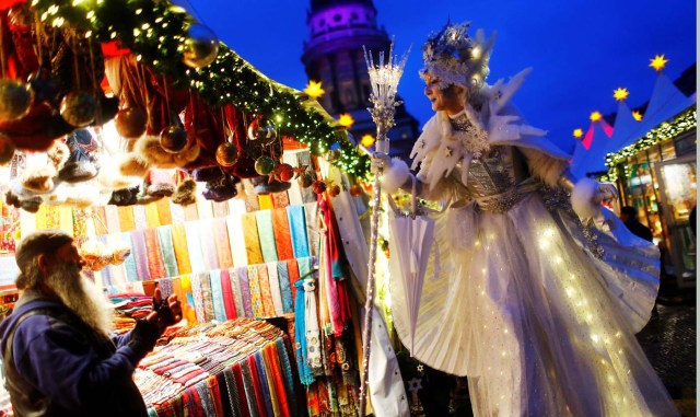An artist dressed as Ice Queen poses at the opening of the Christmas market at Gendarmenmarkt square in Berlin, Germany, November 27, 2017. REUTERS/Hannibal Hanschke