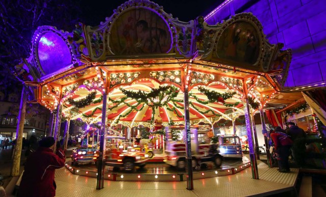 A children's merry-go-round at the Christmas market in Regensburg, Germany, November 27, 2017. REUTERS/Michael Dalder