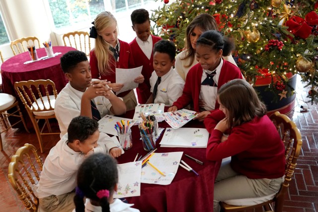 U.S. First Lady Melania Trump greets schoolchildren as she tours the holiday decorations with reporters at the White House in Washington, U.S., November 27, 2017.  REUTERS/Jonathan Ernst