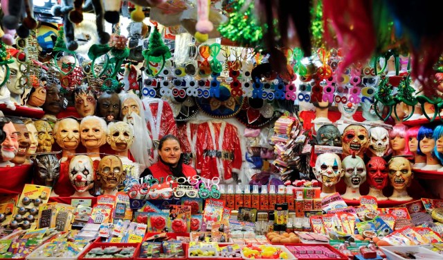 Masks and other trinkets are seen at a Christmas market stall at the Plaza Mayor in Madrid, Spain, November 27, 2017. REUTERS/Paul Hanna