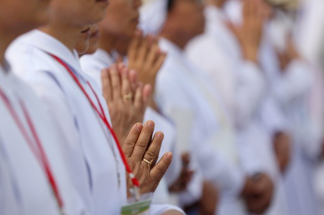 Catholic faithful attend a mass led by Pope Francis at Kyite Ka San Football Stadium in Yangon, Myanmar, November 29, 2017. REUTERS/Soe Zeya Tun