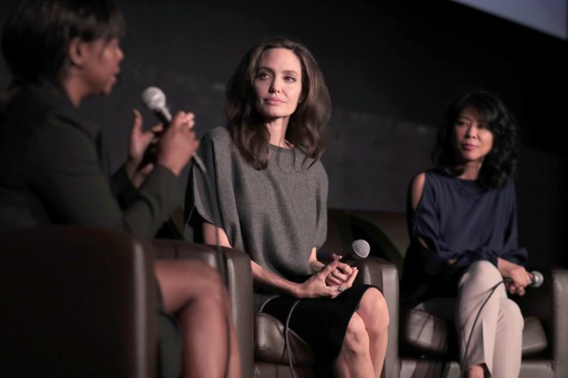 HOLLYWOOD, CA - NOVEMBER 13: (L-R) Festival Director for AFI FEST Jacqueline Lyanga, Angelina Jolie, and Loung Ung speak onstage during "On Collaborative Storytelling: Angelina Jolie And Loung Ung" at AFI FEST 2017 Presented By Audi at the Egyptian Theatre on November 13, 2017 in Hollywood, California.   Christopher Polk/Getty Images for AFI/AFP