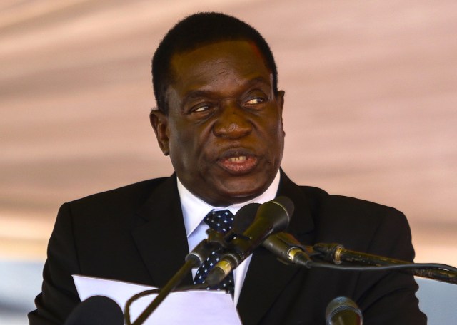 (FILES) This file photo taken on January 7, 2017 shows Zimbabwe's then acting President Emmerson Mnangagwa speaking during a funeral ceremony in Harare.  Zimbabwe is under the control of the military on November 15, 2017, two days after its army chief warned Zimbabwe's President against purging the ruling party's senior ranks. Analysts say it appears to be the climax of a power struggle between liberation-era figures loyal to ousted vice president Emmerson Mnangagwa and forces faithful to First Lady Grace Mugabe, who is seen as vying to succeed her 93-year-old husband.  / AFP PHOTO / Jekesai NJIKIZANA