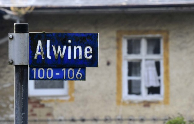 A street sign of Alwine, a splinter settlement of the town Uebigau-Wahrenbrueck, eastern Germany, is pictured on November 30, 2017. On Saturday, Alwine's dozen buildings, plus sheds and garages, are to go under the hammer at an auction in Berlin, with a starting price of 125,000 euros ($148,000). / AFP PHOTO / Tobias Schwarz