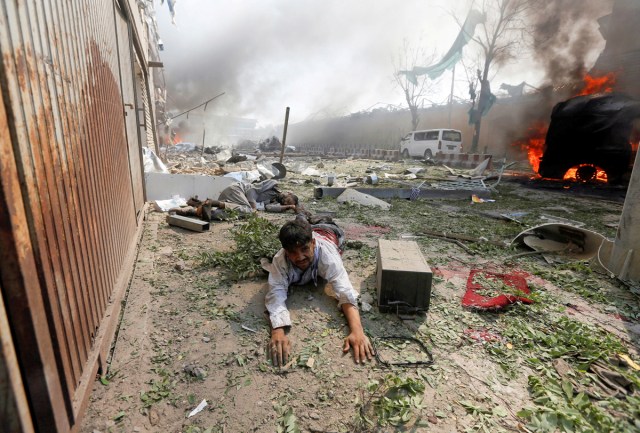 ATTENTION EDITORS - VISUAL COVERAGE OF SCENES OF INJURY OR DEATH - A wounded man lies on the ground at the site of a blast in Kabul, Afghanistan, May 31, 2017. REUTERS/Omar Sobhani/File Photo     TEMPLATE OUT       SEARCH "POY GLOBAL" FOR THIS STORY. SEARCH "REUTERS POY" FOR ALL BEST OF 2017 PACKAGES.    TPX IMAGES OF THE DAY
