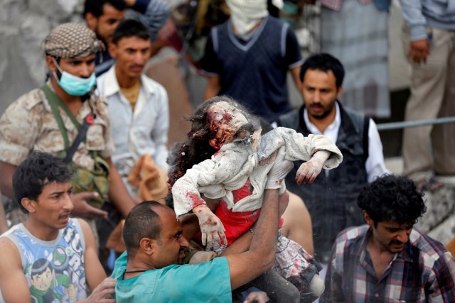 ATTENTION EDITORS - VISUAL COVERAGE OF SCENES OF INJURY OR DEATH - A medic holds the body of Ayah Muhammad Mansour, 7, recovered from under the rubble of a house destroyed by a Saudi-led air strike in Sanaa, Yemen August 25, 2017. Her sister Buthaina Muhammad Mansour survived the air strike. Eight family members were killed, relatives said. REUTERS/Khaled Abdullah/File Photo   TEMPLATE OUT    SEARCH "POY GLOBAL" FOR THIS STORY. SEARCH "REUTERS POY" FOR ALL BEST OF 2017 PACKAGES.    TPX IMAGES OF THE DAY