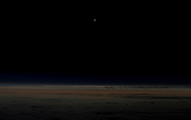 The sun is obscured by the moon during a solar eclipse as seen from an Alaska Airlines commercial jet at 40,000 feet above the Pacific Ocean off the coast of Depoe Bay, Oregon, U.S. August 21, 2017. Location coordinates for this image are 44 degrees 22.417'N 141degrees 10.154'W REUTERS/Jim Urquhart/File Photo      SEARCH "POY GLOBAL" FOR THIS STORY. SEARCH "REUTERS POY" FOR ALL BEST OF 2017 PACKAGES.    TPX IMAGES OF THE DAY