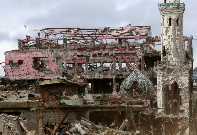 Damaged houses, buildings and a mosque are seen inside Marawi city, Philippines, October 25, 2017. REUTERS/Romeo Ranoco/File Photo      SEARCH "POY GLOBAL" FOR THIS STORY. SEARCH "REUTERS POY" FOR ALL BEST OF 2017 PACKAGES.    TPX IMAGES OF THE DAY