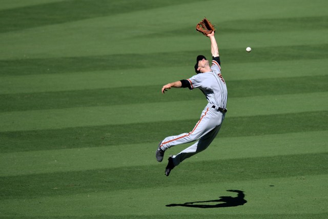San Francisco Giants second baseman Kelby Tomlinson misses a fly ball hit by Los Angeles Dodgers right fielder Curtis Granderson (not pictured), during the second inning at Dodger Stadium in Los Angeles, CA, U.S., September 24, 2017. USA TODAY Sports/Jake Roth/File Photo  SEARCH "POY SPORT" FOR THIS STORY. SEARCH "REUTERS POY" FOR ALL BEST OF 2017 PACKAGES.    TPX IMAGES OF THE DAY