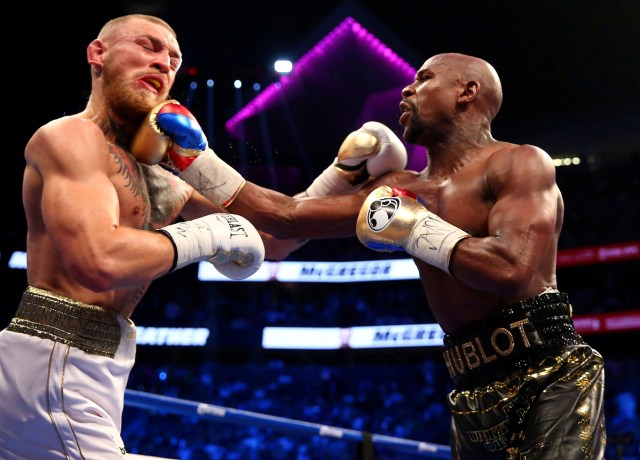 Floyd Mayweather Jr. and  Conor McGregor in action during a bout at T-Mobile Arena in Las Vegas, NV, U.S., August 26, 2017. USA TODAY Sports/Mark J. Rebilas/File Photo  SEARCH "POY SPORT" FOR THIS STORY. SEARCH "REUTERS POY" FOR ALL BEST OF 2017 PACKAGES.    TPX IMAGES OF THE DAY