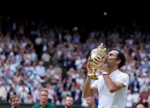 Switzerland's Roger Federer kisses the trophy after winning his Men's Singles Final match against Croatia's Marin Cilic in the Wimbledon Tennis Championships in London, Britain, July 16, 2017. REUTERS/Andrew Couldridge/File Photo  SEARCH "POY SPORT" FOR THIS STORY. SEARCH "REUTERS POY" FOR ALL BEST OF 2017 PACKAGES.    TPX IMAGES OF THE DAY
