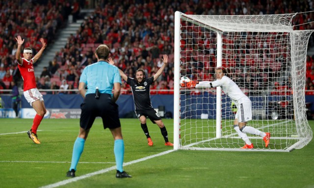 Benfica's Mile Svilar carries the ball over the line as Manchester United's Marcus Rashford (not pictured) scores their first goal during the Champions League match between S.L. Benfica and Manchester United at Estadio da Luz, Lisbon, Portugal, October 18, 2017. Action Images via Reuters/Carl Recine/File Photo  SEARCH "POY SPORT" FOR THIS STORY. SEARCH "REUTERS POY" FOR ALL BEST OF 2017 PACKAGES.    TPX IMAGES OF THE DAY
