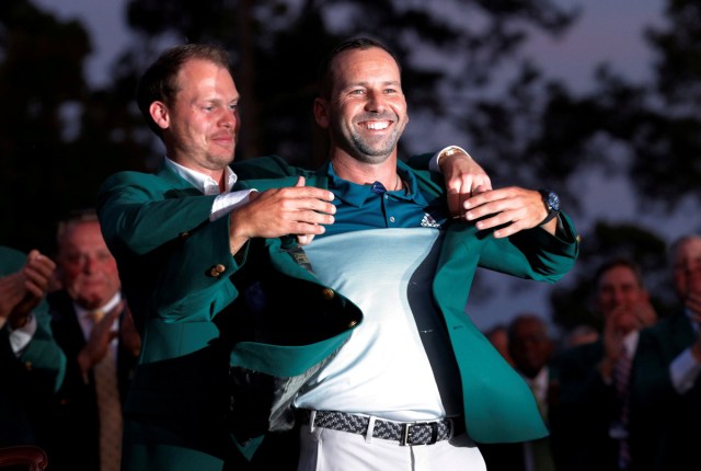 Sergio Garcia of Spain smiles as he is presented the green jacket by last year's champion, Danny Willett of England, after winning the 2017 Masters golf tournament in a playoff at Augusta National Golf Club in Augusta, Georgia, U.S., April 9, 2017. REUTERS/Mike Segar/File Photo  SEARCH "POY SPORT" FOR THIS STORY. SEARCH "REUTERS POY" FOR ALL BEST OF 2017 PACKAGES.    TPX IMAGES OF THE DAY
