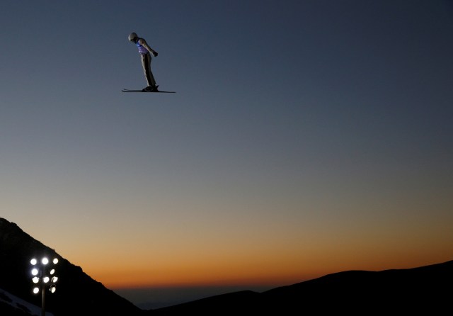 Qi Guangpu of China performs an aerial in the Men's Aerials training during the FIS Snowboarding and Freestyle Skiing World Championships in Sierra Nevada, Spain, March 9, 2017. REUTERS/Paul Hanna/File Photo  SEARCH "POY SPORT" FOR THIS STORY. SEARCH "REUTERS POY" FOR ALL BEST OF 2017 PACKAGES.    TPX IMAGES OF THE DAY