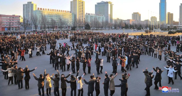 People dance on a square in Pyongyang, North Korea in this undated photo released by North Korea's Korean Central News Agency (KCNA) November 30, 2017. REUTERS/KCNA ATTENTION EDITORS - THIS IMAGE WAS PROVIDED BY A THIRD PARTY. REUTERS IS UNABLE TO INDEPENDENTLY VERIFY THIS IMAGE. NO THIRD PARTY SALES. SOUTH KOREA OUT. NO COMMERCIAL OR EDITORIAL SALES IN SOUTH KOREA