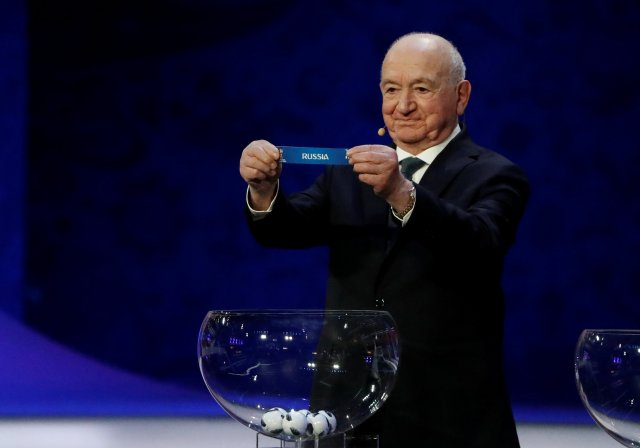 Soccer Football - 2018 FIFA World Cup Draw - State Kremlin Palace, Moscow, Russia - December 1, 2017 Nikita Simonyan pulls out Russia during the draw REUTERS/Grigory Dukor