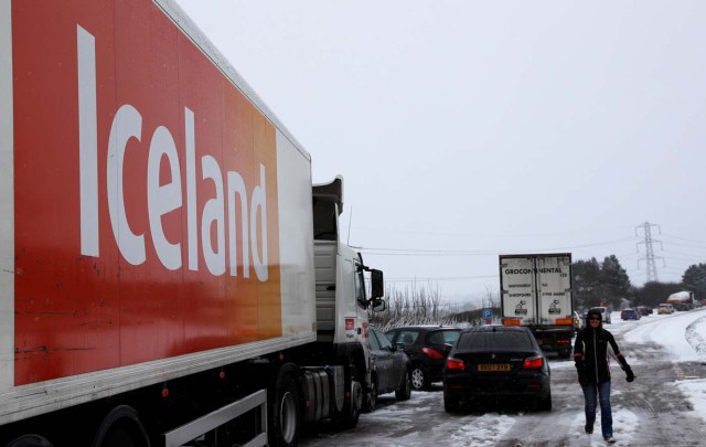 Vehicles backed up on the A50 are seen after a lorry crashed in the snow near Uttoxeter, Britain, December 10, 2017. REUTERS/Darren Staples