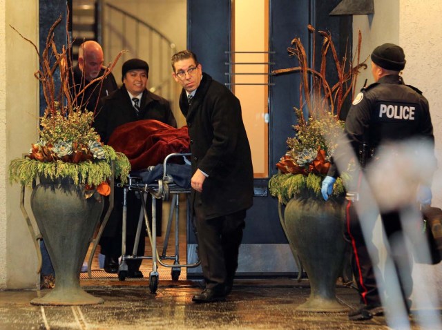 One of two bodies is removed from the home of billionaire founder of Canadian pharmaceutical firm Apotex Inc., Barry Sherman and his wife Honey, who were found dead under circumstances that police described as "suspicious" in Toronto, Ontario, Canada, December 15, 2017. REUTERS/Chris Helgren