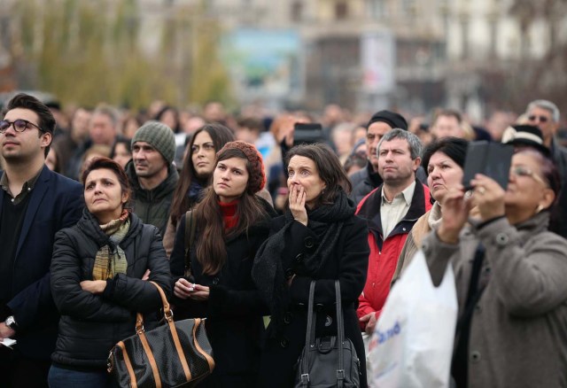 People look on during a funeral ceremony for late Romanian King Michael in Bucharest, Romania, December 16, 2017. REUTERS/Stoyan Nenov