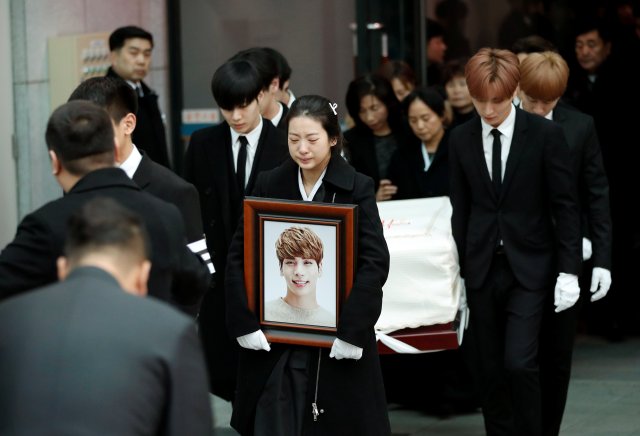 A portrait and the coffin of Kim Jong-hyun, the lead singer of top South Korean boy band SHINee, is carried during his funeral at a hospital in Seoul, South Korea, December 21, 2017. REUTERS/Kim Hong-Ji