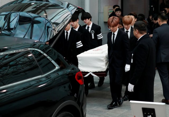 The coffin of Kim Jong-hyun, the lead singer of top South Korean boy band SHINee, is carried by his celebrity colleagues to a hearse during his funeral at a hospital in Seoul, South Korea, December 21, 2017. REUTERS/Kim Hong-Ji