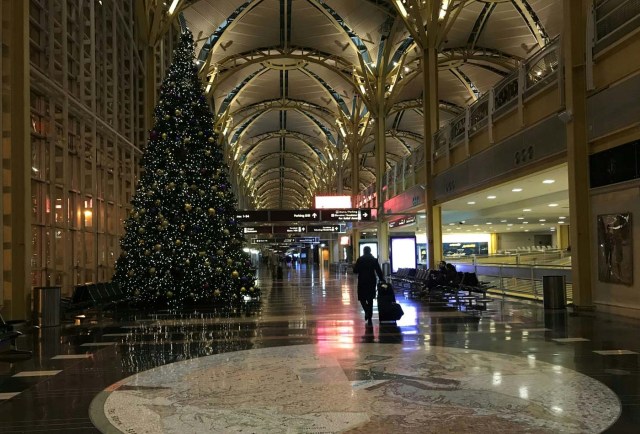 A man walks through the empty lobby of Ronald Reagan airport, near Washington, DC, early January 4, 2018 as winter storm Grayson sets in on the East Coast. The National Weather Service said the rapidly deepening area of low pressure off Florida's east coast will move northeastward bringing snow to the southern mid-Atlantic coast and then to New England as it moves towards the Canadian Maritimes by Friday. / AFP PHOTO / Daniel SLIM / ?The erroneous mention[s] appearing in the metadata of this photo by Daniel SLIM has been modified in AFP systems in the following manner: [Byline should read "Daniel SLIM] instead of [Eva Hambach]. Please immediately remove the erroneous mention[s] from all your online services and delete it (them) from your servers. If you have been authorized by AFP to distribute it (them) to third parties, please ensure that the same actions are carried out by them. Failure to promptly comply with these instructions will entail liability on your part for any continued or post notification usage. Therefore we thank you very much for all your attention and prompt action. We are sorry for the inconvenience this notification may cause and remain at your disposal for any further information you may require.?