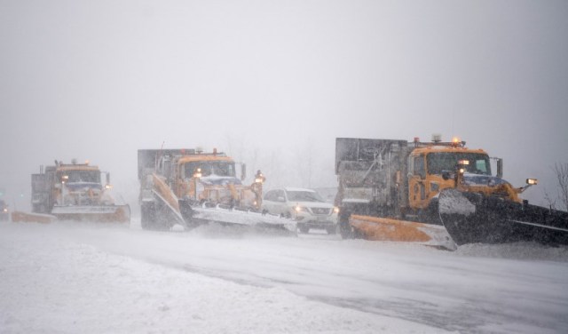 MEDFORD, NY - JANUARY 4: Trucks plow Rt. 112 as a blizzard hits the Northeastern part of the United States on January 4, 2018 in Medford, New York. From Maine to Florida every state along the east coast is expected to have to deal with winter weather.   Andrew Theodorakis/Getty Images/AFP