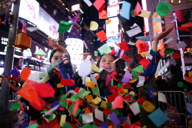Revelers celebrate the New Year in Times Square in Manhattan, New York, U.S., January 1, 2018. REUTERS/Amr Alfiky TPX IMAGES OF THE DAY