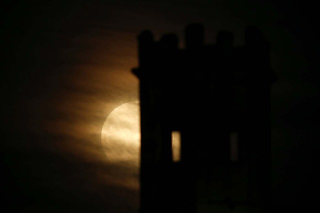 A 'supermoon' full moon rises behind the guard tower on the 17th century San Salvatore Bastion in Pieta, Malta, January 1, 2018. REUTERS/Darrin Zammit Lupi