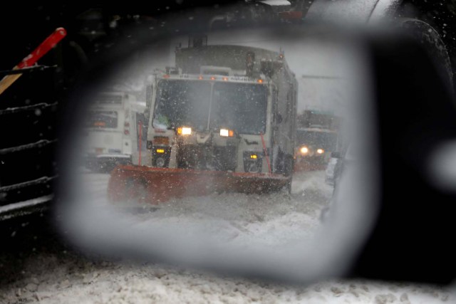A snowplow is seen in a car's side mirror in upper Manhattan during Storm Grayson in New York City, New York, U.S., January 4, 2018. REUTERS/Mike Segar TPX IMAGES OF THE DAY