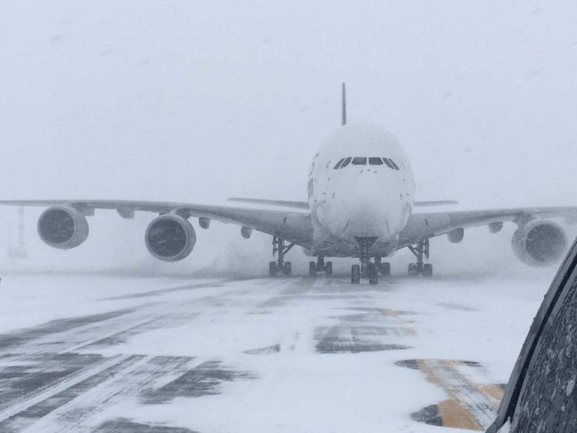 A Singapore Airlines Airbus A380, diverted from John F. Kennedy Airport during a winter storm, is shown on the runway after landing at Stewart International Airport in Newburgh, New York, U.S., January 4, 2018. Courtesy of Stewart Airport/Handout via REUTERS ATTENTION EDITORS - THIS IMAGE WAS PROVIDED BY A THIRD PARTY
