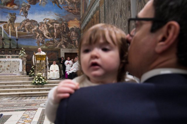 Pope Francis leads a ceremony of baptism during a solemn mass in the Sistine Chapel at the Vatican January 7, 2018. Osservatore Romano/Handout via REUTERS ATTENTION EDITORS - THIS IMAGE WAS PROVIDED BY A THIRD PARTY.