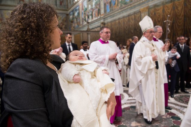 Pope Francis leads a ceremony of baptism during a solemn mass in the Sistine Chapel at the Vatican January 7, 2018. Osservatore Romano/Handout via REUTERS ATTENTION EDITORS - THIS IMAGE WAS PROVIDED BY A THIRD PARTY.