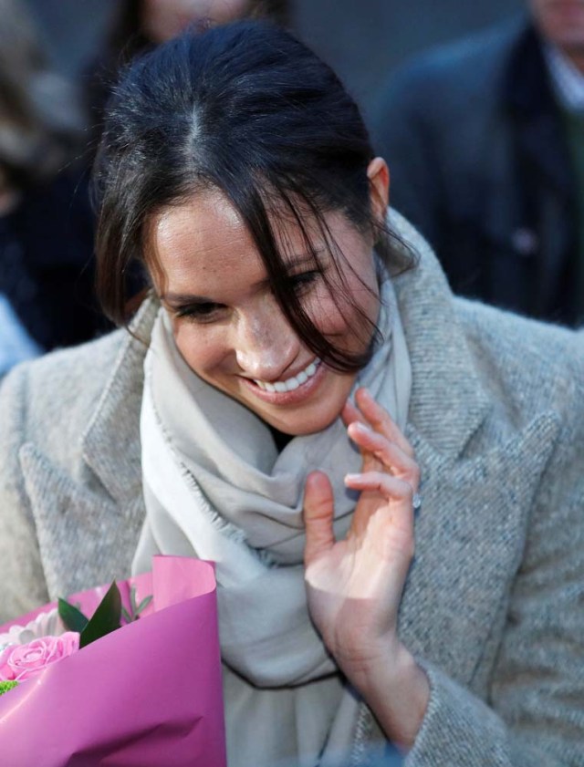 Meghan Markle greets a well wisher as she leaves after visiting radio station Reprezent FM with her fiancee Britain's Prince Harry, in Brixton, London January 9, 2018. REUTERS/Peter Nicholls