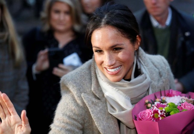 Meghan Markle greets a well wisher as she leaves after visiting radio station Reprezent FM with her fiancee Britain's Prince Harry, in Brixton, London January 9, 2018. REUTERS/Peter Nicholls