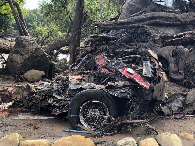 Parts of a damaged car are entangled in debris after mudslides in Montecito, California, U.S. in this photo provided by the Santa Barbara County Fire Department, January 9, 2018. Picture taken January 9, 2018. Mike Eliason/Santa Barbara County Fire Department/Handout via REUTERS ATTENTION EDITORS - THIS IMAGE WAS PROVIDED BY A THIRD PARTY.