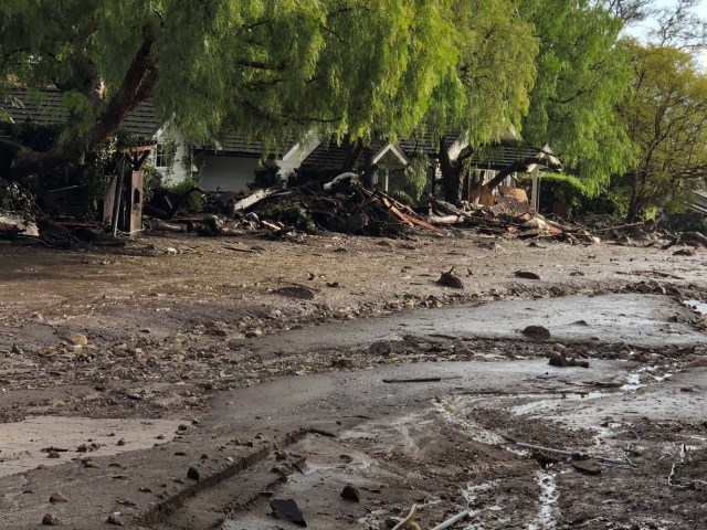 Cottages surrounded by debris and mud after mudslides are seen in Montecito, California, U.S. in this photo provided by the Santa Barbara County Fire Department, January 9, 2018. Picture taken January 9, 2018. Mike Eliason/Santa Barbara County Fire Department/Handout via REUTERS ATTENTION EDITORS - THIS IMAGE WAS PROVIDED BY A THIRD PARTY.