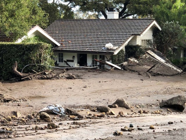 Cottages are surrounded by several feet of mud and debris after mudslides in Montecito, California, U.S. in this photo provided by the Santa Barbara County Fire Department, January 9, 2018. Picture taken January 9, 2018. Mike Eliason/Santa Barbara County Fire Department/Handout via REUTERS ATTENTION EDITORS - THIS IMAGE WAS PROVIDED BY A THIRD PARTY.