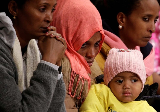 Migrants wait for Pope Francis to lead a special mass to mark International Migrants Day in Saint Peter's Basilica at the Vatican January 14, 2018. REUTERS/Max Rossi