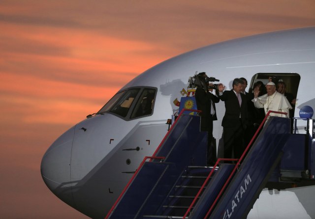 Pope Francis waves before boarding the plane, in Lima, Peru January 21, 2018. REUTERS/Pilar Olivares