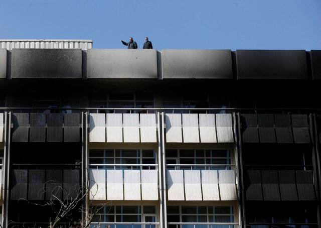 Afghan security forces stand on the roof top of the Intercontinental Hotel a day after an attack in Kabul, Afghanistan January 22, 2018. REUTERS/Omar Sobhani