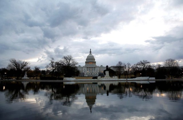 Clouds pass over the U.S. Capitol at the start of the third day of a shut down of the federal government in Washington, U.S., January 22, 2018. REUTERS/Joshua Roberts