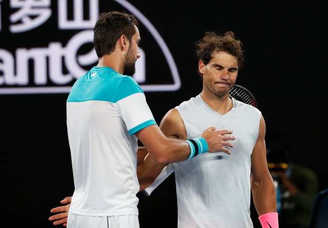 Tennis - Australian Open - Quarterfinals - Rod Laver Arena, Melbourne, Australia, January 23, 2018. Spain's Rafael Nadal and Croatia's Marin Cilic after Rafael Nadal retires from the match due to injury. REUTERS/Issei Kato